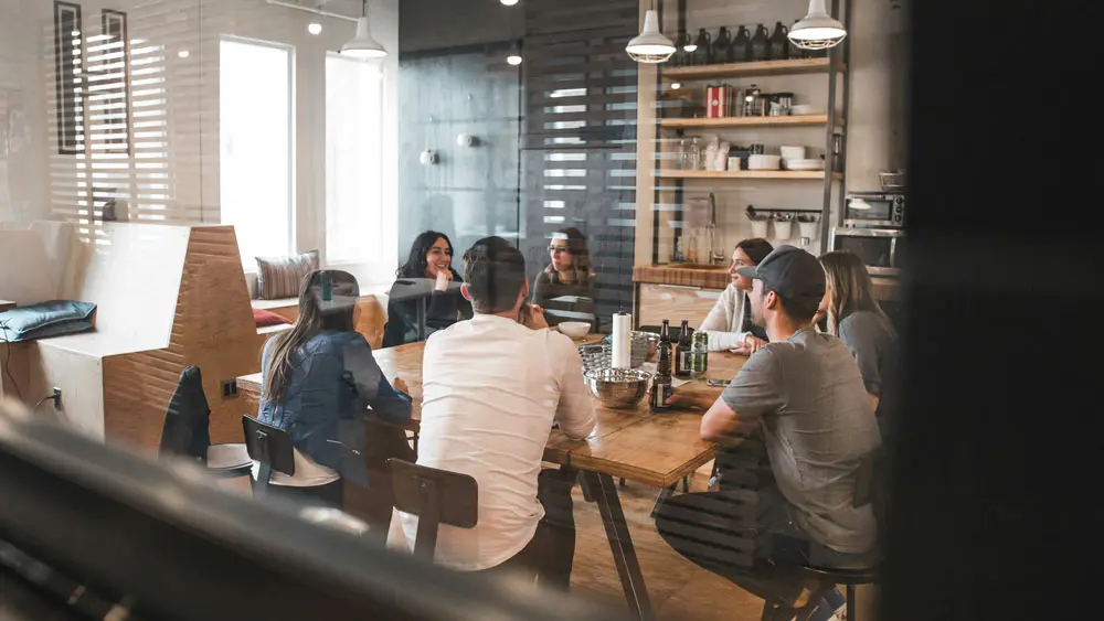 Business professionals collaborating in an Apollo UK Power Team meeting, building trusted relationships and sharing expertise in a structured, high-trust networking environment